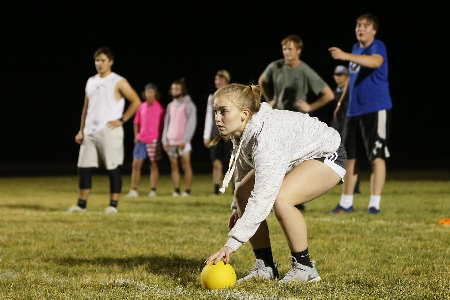 Cassie Downare picks up a ball from the corner of the field